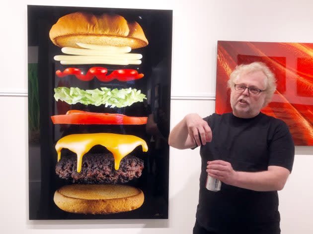 Nathan Myhrvold talks cheeseburgers and photography in his new Modernist Cuisine Gallery in downtown Seattle in front of the stylized images of food that he captures. (GeekWire Photo / Kurt Schlosser) <a href="https://www.geekwire.com/2018/hungry-new-art-seattle-nathan-myhrvolds-modernist-cuisine-gallery-showcases-food-photos/" rel="nofollow noopener" target="_blank" data-ylk="slk:Read the story.;elm:context_link;itc:0;sec:content-canvas" class="link "><strong>Read the story.</strong></a>