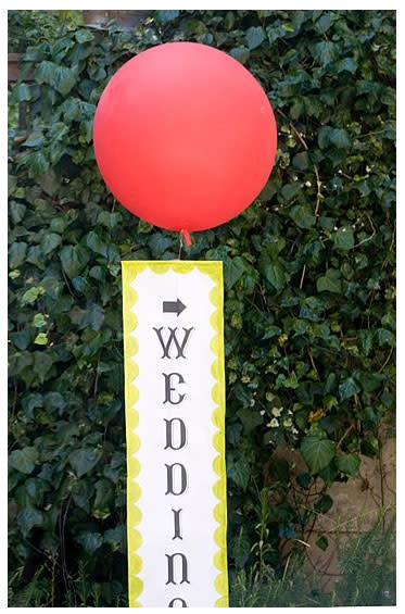 Dress up a modest corner of your wedding reception with a cheerful bouquet of bright balloons.