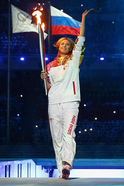 Olympic torch bearer Maria Sharapova enters the Opening Ceremony of the Sochi 2014 Winter Olympics at Fisht Olympic Stadium