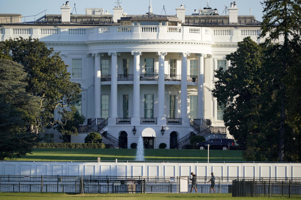 The White House is seen in Washington, early Saturday, Oct. 3, 2020, the morning after President Donald Trump was taken to a military hospital after being stricken by COVID-19. (AP Photo/J. Scott Applewhite)