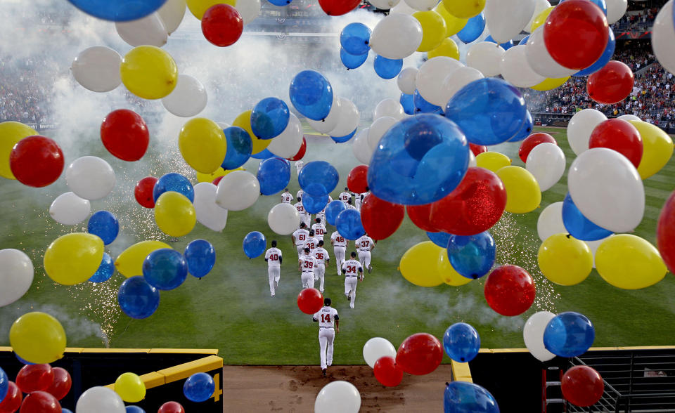 <p>The Atlanta Braves take the field during the team’s season home opening baseball game against the Milwaukee Brewers, April 13, 2012, in Atlanta. (AP Photo/David Goldman) </p>