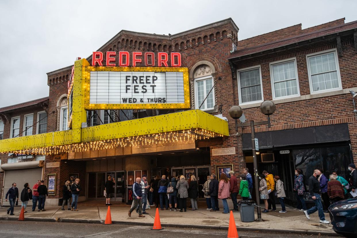 People enter for the showing of the 'Boblo Boats: Detroit Ferry Tale' movie during the opening night for the Freep Film Festival at Redford Theatre in Detroit on Wednesday, September 22, 2021.