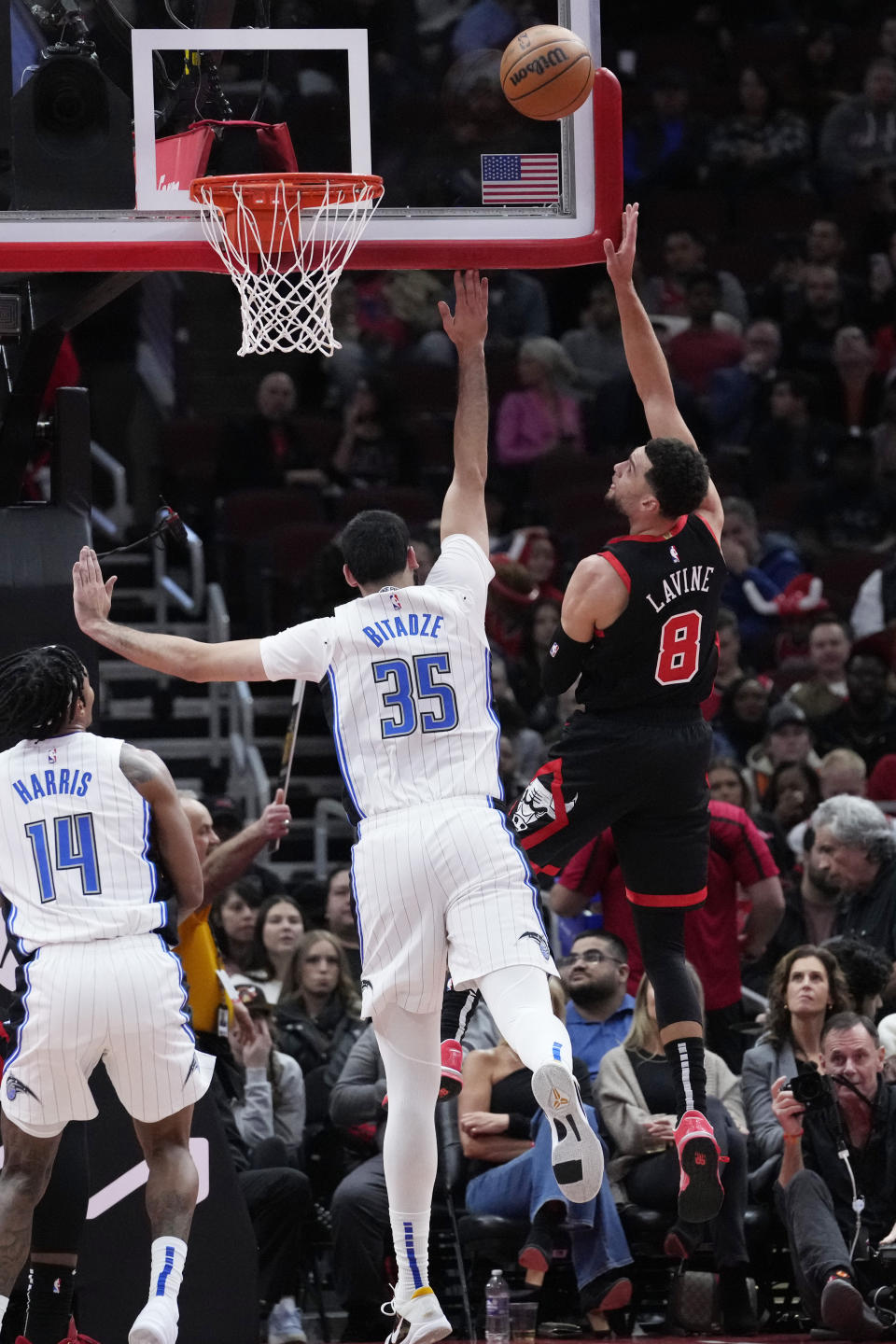 Chicago Bulls guard Zach LaVine, right, shoots over Orlando Magic center Goga Bitadze during the first half of an NBA basketball game in Chicago, Friday, Nov. 17, 2023. (AP Photo/Nam Y. Huh)