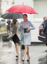 <p>The Duchess stepped out on a rainy day in London in a pale blue cashmere blend coat <a href="https://www.seraphine.com/en-us/natasha-cashmere-blend-coat.html?" rel="nofollow noopener" target="_blank" data-ylk="slk:by Seraphine, which is still on sale for $299.;elm:context_link;itc:0;sec:content-canvas" class="link ">by Seraphine, which is still on sale for $299.</a> She accessorized with a black clutch and black heels.</p>