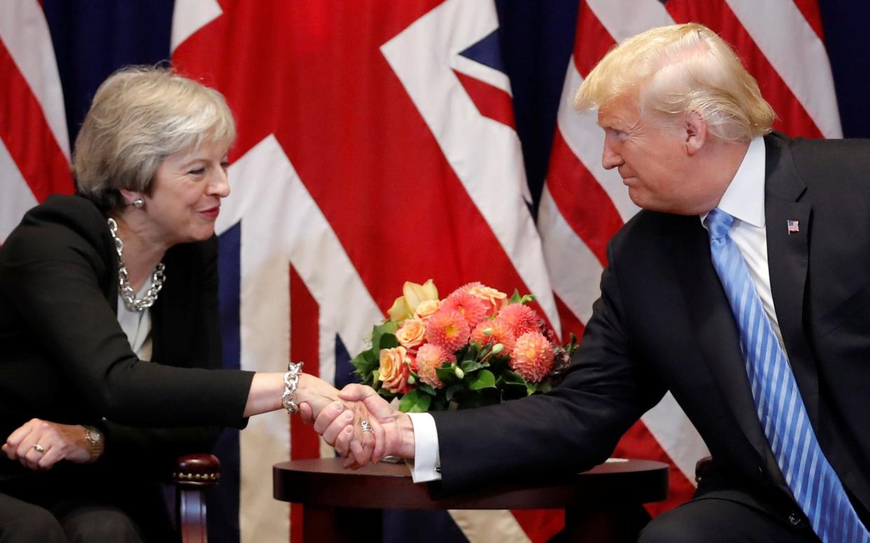 Donald Trump and Theresa May in a meeting in September - REUTERS