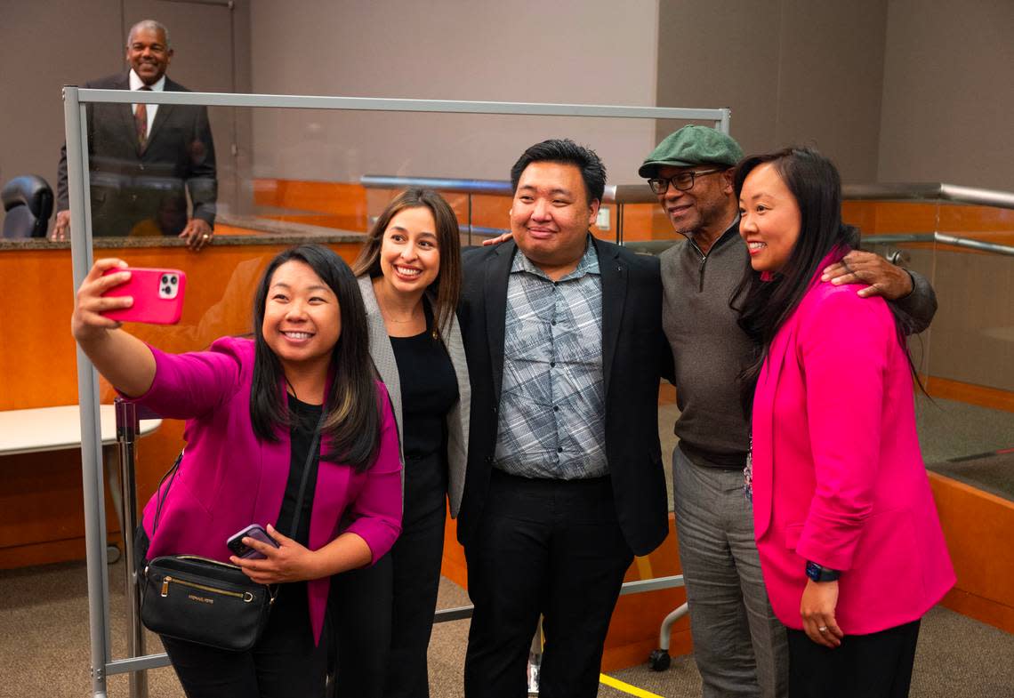 Interim District 2 Sacramento City Councilman Shoun Thao, center, poses for a picture taken by sister Gloria Thao with Councilwoman Karina Talamantes, former Councilman Allen Warren and Councilwoman Mai Vang before being sworn-in on Tuesday. Thao worked as a city staffer for Warren.