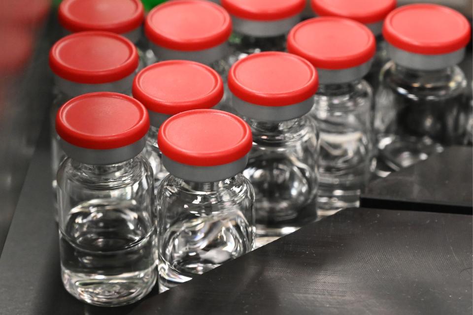 Capped vials are being pictured during filling and packaging tests for the large-scale production and supply of the University of Oxfords COVID-19 vaccine candidate, AZD1222. Photo: Vincenzo Pinto/AFP via Getty Images