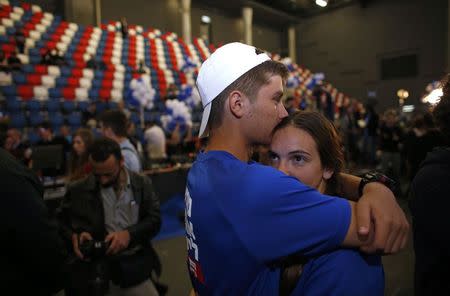 Zionist Union party supporters react after hearing exit poll results in Tel Aviv March 17, 2015. REUTERS/Ronen Zvulun