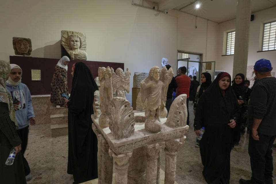 People visit the Iraqi National Museum in Baghdad, Iraq, Friday, Feb. 24, 2023, which reopened to the public after months or maintenance work. Iraq's national museum was looted and vandalized by a frenzied mob during the U.S.-led invasion in April 2003 to topple Saddam Hussein. (AP Photo/Hadi Mizban)