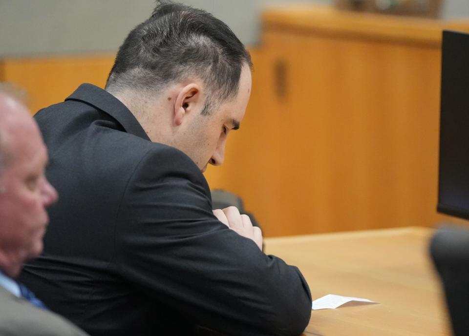 Daniel Perry closes his eyes and bows his head Friday moments before he was convicted of murder in the July, 25, 2020 shooting death of protester Garrett Foster.