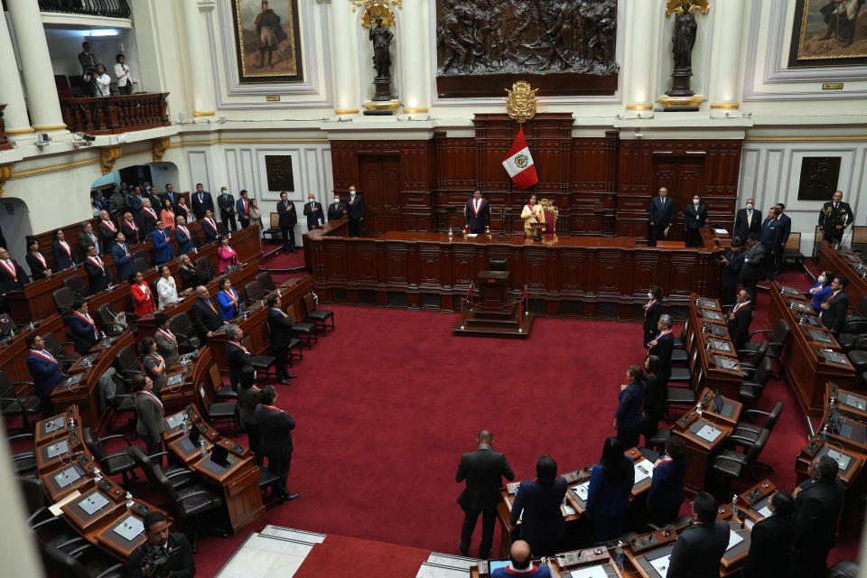 Former Vice President Dina Boluarte, top right, sings the national anthem after being sworn-in as the new president in Lima, Peru, Wednesday, Dec. 7, 2022. Peru's Congress voted to removePresident Pedro Castillofrom office Wednesday and replace him with the vice president, shortly after Castillo tried to dissolve the legislature ahead of a scheduled vote to remove him. At left is Congress President Jose Williams and at right is Jose Cevasco. (AP Photo/Guadalupe Pardo)