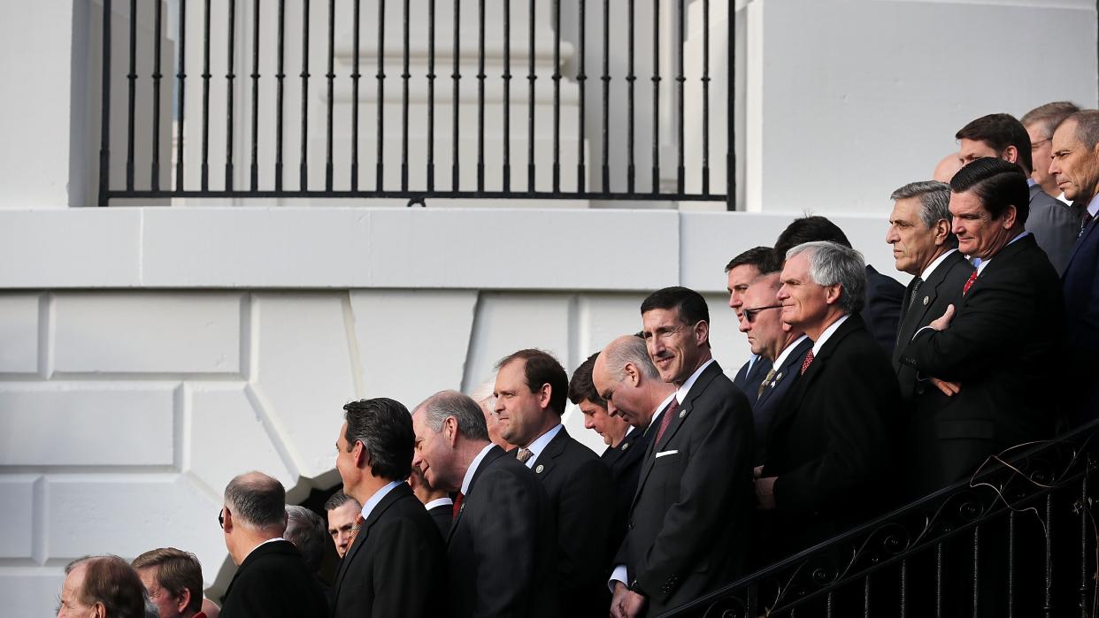  Republican members of Congress line the stairs on the south side of the White House during an event to celebrate Congress passing the Tax Cuts and Jobs Act December 20, 2017 . 