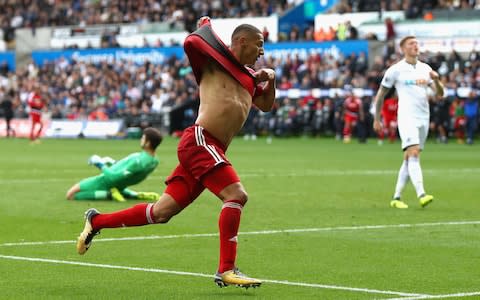 Richarlison takes his shirt off after scoring against Swansea - Credit: Getty Images