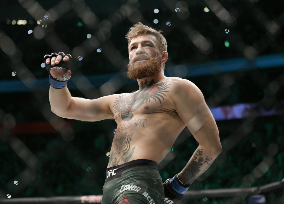 FILE - In this Oct. 6, 2018, file photo, Conor McGregor walks in the cage before fighting Khabib Nurmagomedov in a lightweight title mixed martial arts bout at UFC 229 in Las Vegas. Superstar UFC fighter McGregor has announced on social media that he is retiring from mixed martial arts. McGregor’s verified Twitter account had a post early Tuesday, March 26, 2019, that said the former featherweight and lightweight UFC champion was making a “quick announcement.” (AP Photo/John Locher, File)