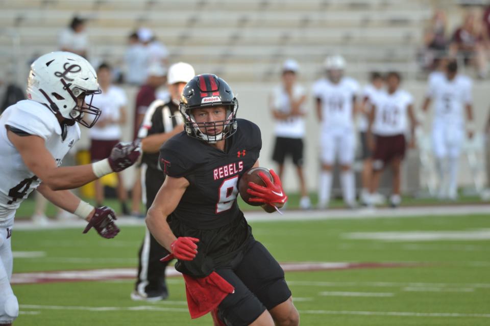Tascosa quarterback Hudson Farris (9) runs the ball against Midland Legacy in their non-district game on Friday, Sept. 2, 2022 at West Texas A&M.