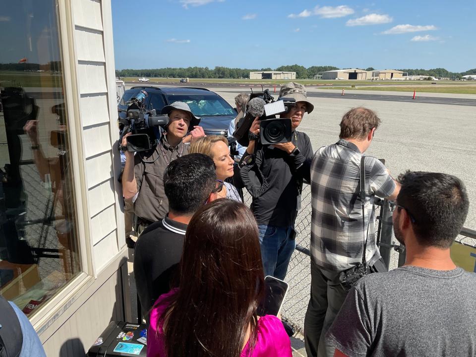 Many reporters gathered at Delaware Coastal Airport in anticipation of a possible flight arriving carrying migrants from Florida on Tuesday, Sept. 20, 2022.