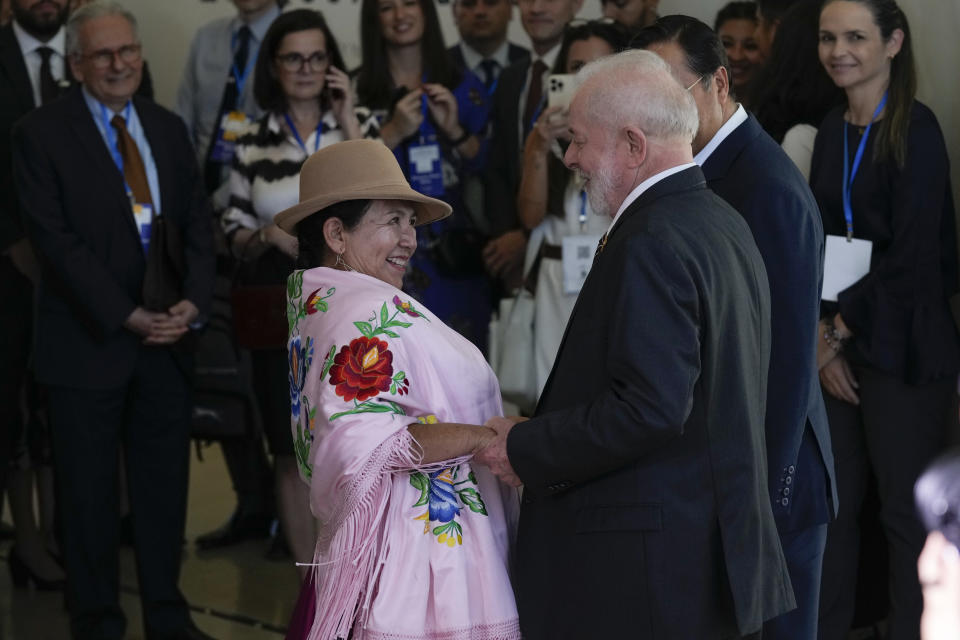 Brazilian President Luiz Inacio Lula da Silva, right, greets Bolivia's Foreign Minister Celinda Sosa Lunda, during the 63rd Mercosur Summit, in Rio de Janeiro, Brazil, Thursday, Dec. 7, 2023. (AP Photo/Silvia Izquierdo)