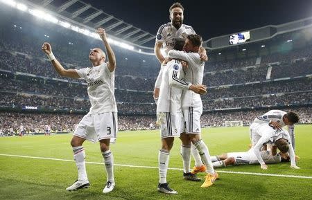 Football - Real Madrid v Atletico Madrid - UEFA Champions League Quarter Final Second Leg - Estadio Santiago Bernabeu, Madrid, Spain - 22/4/15 Pepe (L), Cristiano Ronaldo, Sergio Ramos and Dani Carvajal celebrate after Javier Hernandez (R floor) scored the first goal for Real Madrid Reuters / Juan Medina. Livepic