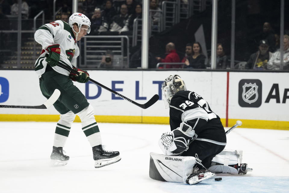 Minnesota Wild left wing Matt Boldy (12) scores past Los Angeles Kings goaltender Cam Talbot (39) during the first period of an NHL hockey game, Monday, April 15, 2024, in Los Angeles. (AP Photo/Kyusung Gong)