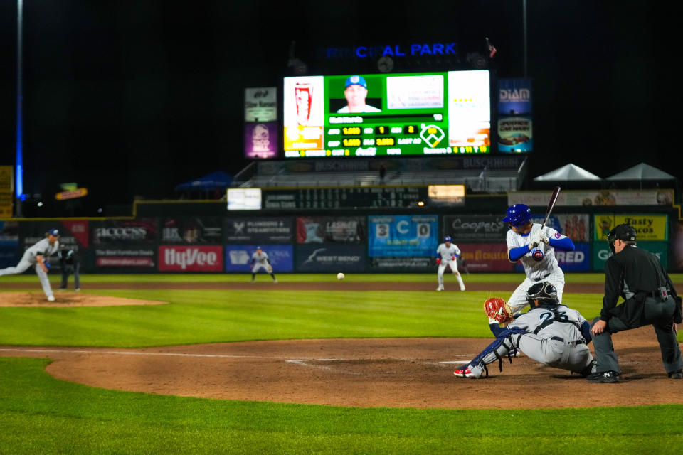 Iowa Cubs first baseman Matt Mervis (41) watches the pitch come toward the plate during the season opener at Principal Park in Des Moines on March 31.