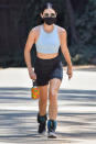 <p>Lucy Hale went for a walk with weights on her ankles and a black face mask in Los Angeles.</p>
