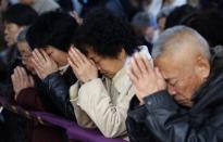 Believers take part in a weekend mass at an underground Catholic church in Tianjin November 10, 2013. Picture taken November 10, 2013. REUTERS/Kim Kyung-Hoon