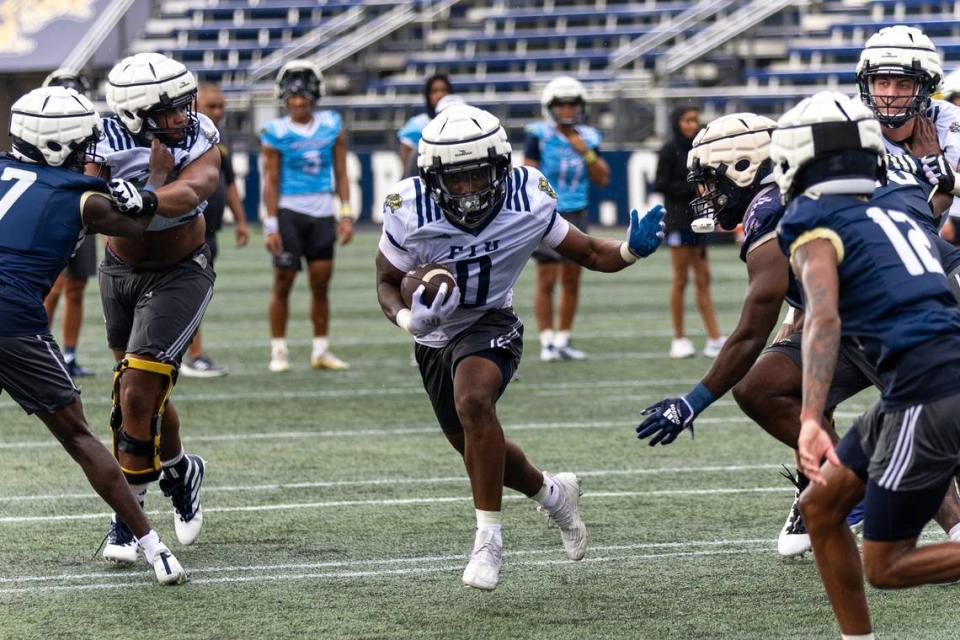 Florida International University running back Shomari Lawrence (0) runs the ball during practice at FIU Football Stadium in Miami, Florida, on Wednesday, July 26, 2023.