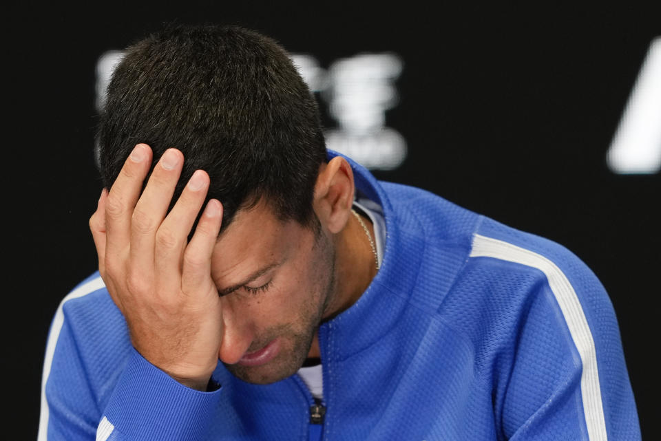 Novak Djokovic of Serbia reacts during a press conference following his loss to Jannik Sinner of Italy in their semifinal at the Australian Open tennis championships at Melbourne Park, Melbourne, Australia, Friday, Jan. 26, 2024. (AP Photo/Louise Delmotte)