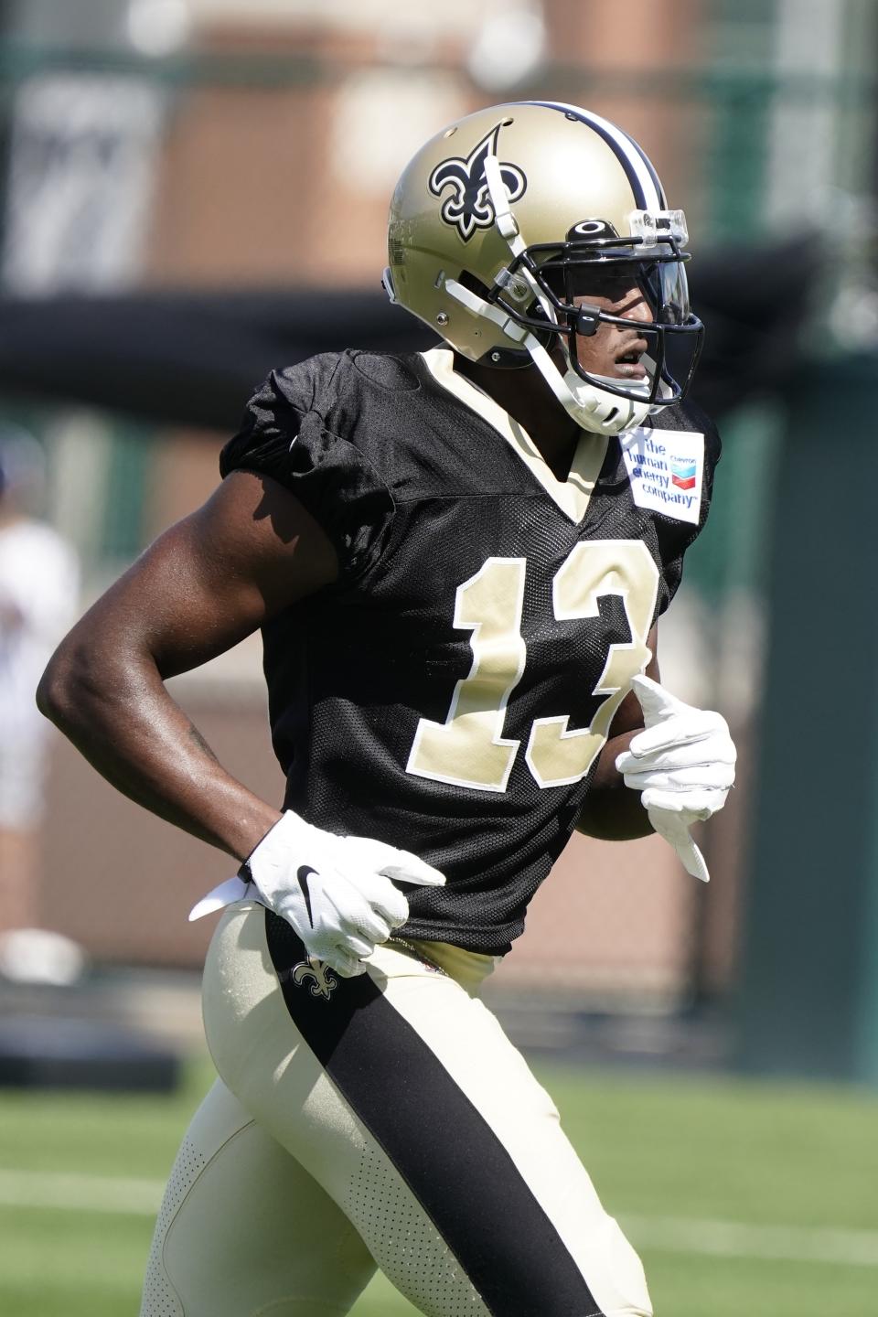 New Orleans Saints' Michael Thomas runs a drill before an NFL football joint practice session with the Green Bay Packers Tuesday, Aug. 16, 2022, in Green Bay, Wis. (AP Photo/Morry Gash)