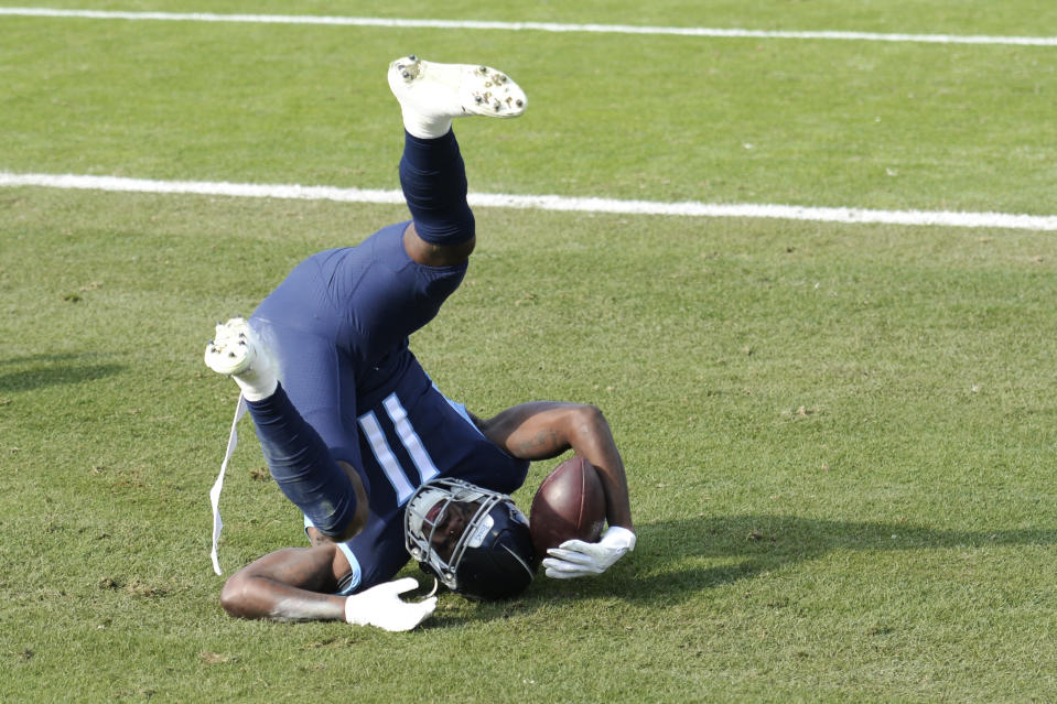 Tennessee Titans wide receiver A.J. Brown (11) catches a touchdown pass against the Baltimore Ravens in the first half of an NFL wild-card playoff football game Sunday, Jan. 10, 2021, in Nashville, Tenn. (AP Photo/Mark Zaleski)