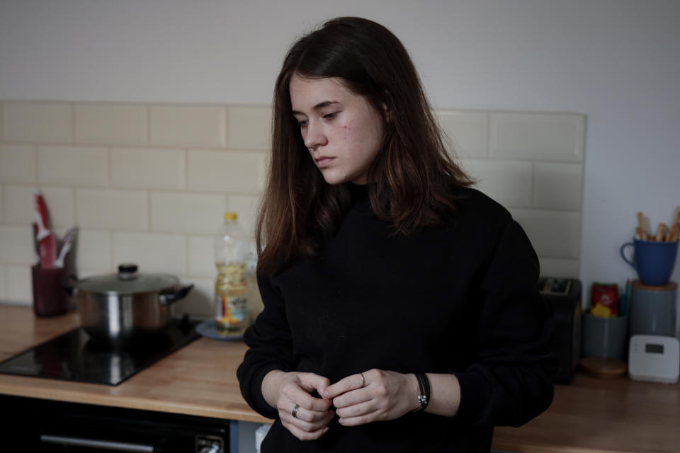 Anastasia Yevdokimova, 21, from Odesa pauses during an interview with The Associated Press, in Brasov, Romania, Wednesday, March 30, 2022. Having escaped from Russian shelling, Ukrainian refugees are now focused on building new lives — temporarily or permanently. Countries neighboring their homeland, like Poland and Romania, are sparing no effort to help them integrate and feel needed in the new environment. (AP Photo/Stephen McGrath)