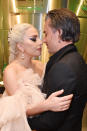 <p>The singer shared a quiet moment with fiancé Christian Carino backstage at the Grammys. Gaga hit the stage on music’s biggest night to give a powerful performance of “Joanne” and “Million Reasons” during the ceremony. (Photo: Kevin Mazur/Getty Images for NARAS) </p>
