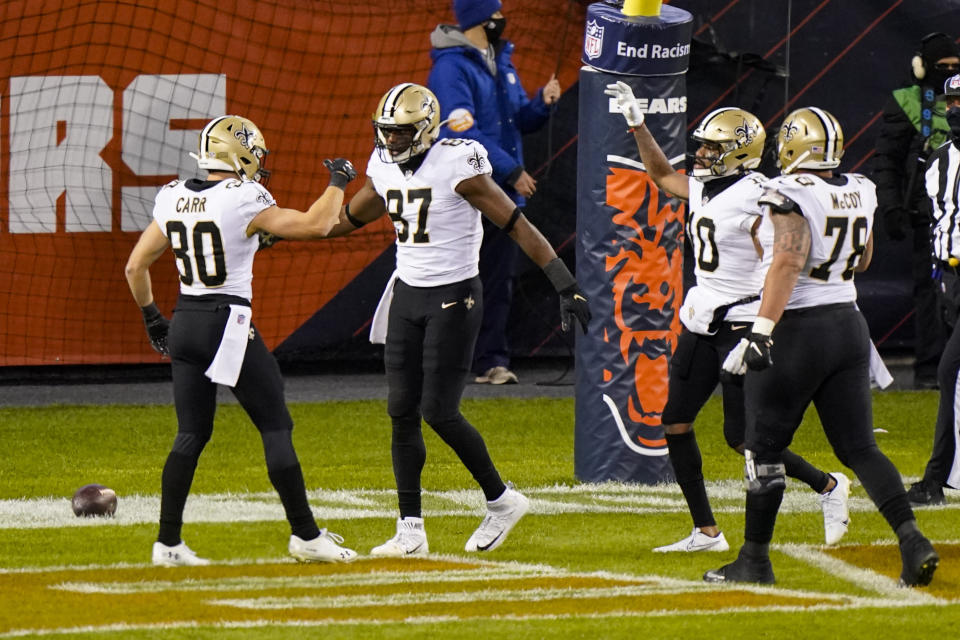 New Orleans Saints tight end Jared Cook (87) celebrates a touchdown with wide receiver Austin Carr (80) in the first half of an NFL football game against the Chicago Bears in Chicago, Sunday, Nov. 1, 2020. (AP Photo/Nam Y. Huh)