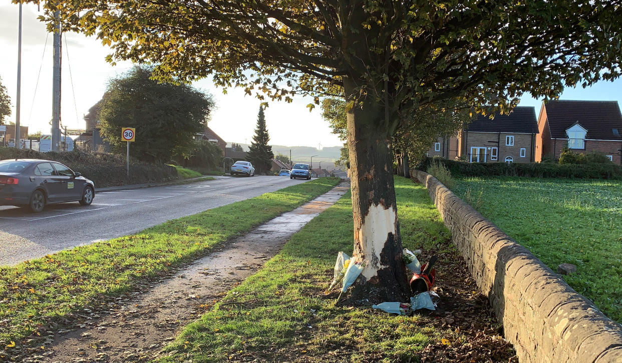 The scene in Rotherham where three teenagers died in a car crash after a vehicle came off the road and struck a tree. Picture date: Monday October 25, 2021.