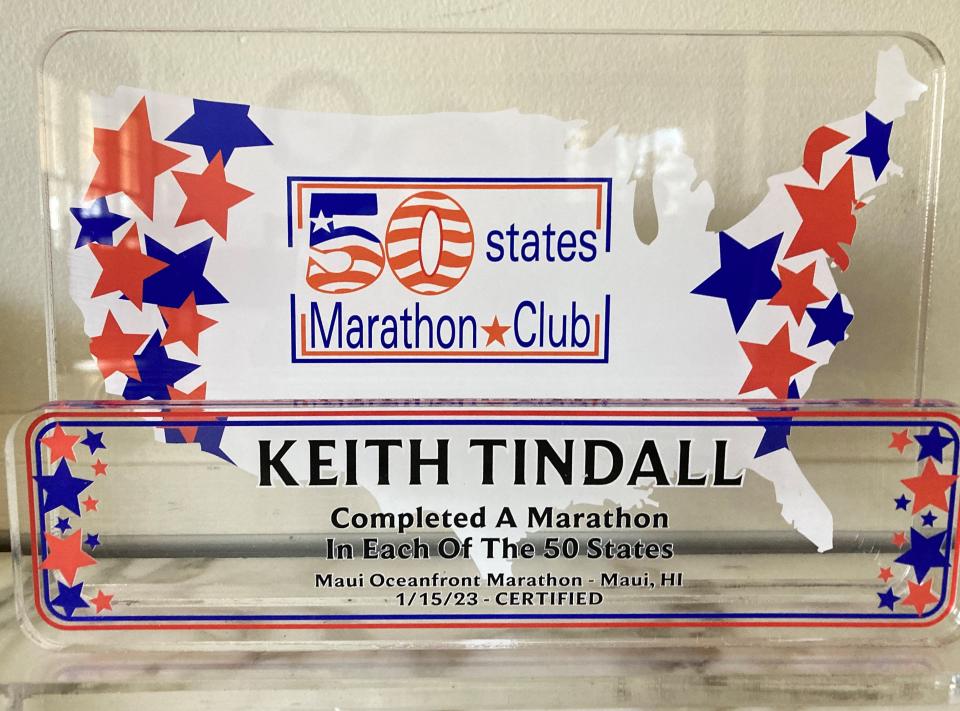 Keith Trindall earned this trophy for finishing a marathon in each of the 50 states.