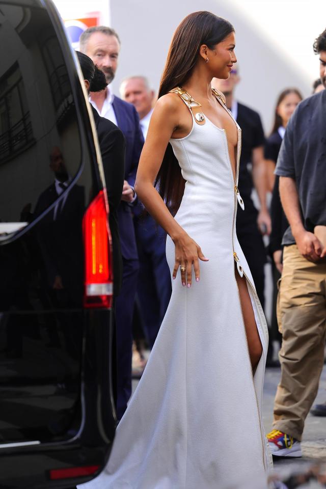 Zendaya arrives at Louis Vuitton in dangerously low-cut zipper gown