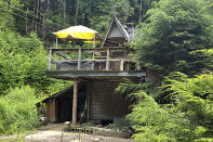 This undated photo provided by Jodie Gedeon shows the shack that David Lidstone, 81, has built and lived in for nearly three decades in the woods of Canterbury, N.H., growing his own food and cutting his firewood. He's now jailed after not complying with a court order to leave, and there's a growing petition to just let "River Dave" live out his days off the grid. (Jodie Gedeon via AP)