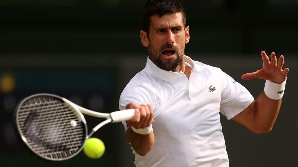 Djokovic plays a forehand against Carlos Alcaraz during this year's Wimbledon final. - Julian Finney/Getty Images