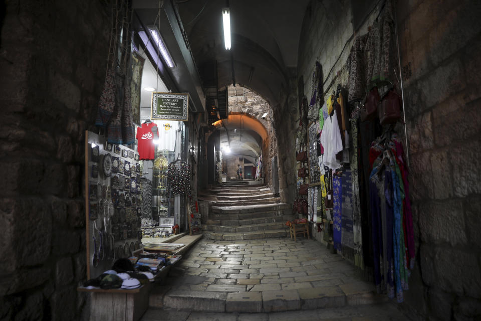 A deserted alley is seen in in Jerusalem's Old City, Sunday, March 15, 2020. Israel imposed sweeping travel and quarantine measures more than a week ago but has seen its number of confirmed coronavirus cases double in recent days, to around 200. On Saturday, the government said restaurants, malls, cinemas, gyms and daycare centers would close. (AP Photo/Mahmoud Illean)