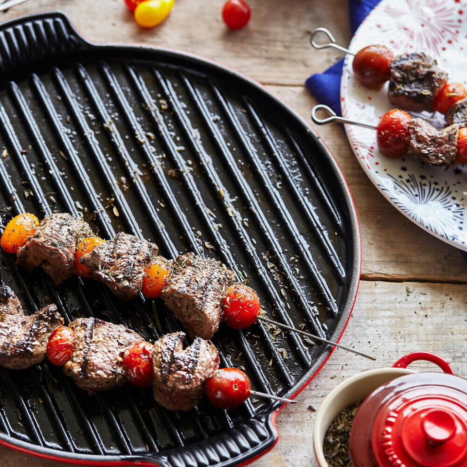 To get grill marks, this grill pan from Le Creuset is made from cast iron and can be used on top of your stove. You can pick between artichoke, indigo and cerise colors. <a href="https://fave.co/3nAZjfJ" target="_blank" rel="noopener noreferrer">Originally $160, get it now for $100 at Sur La Table</a>.