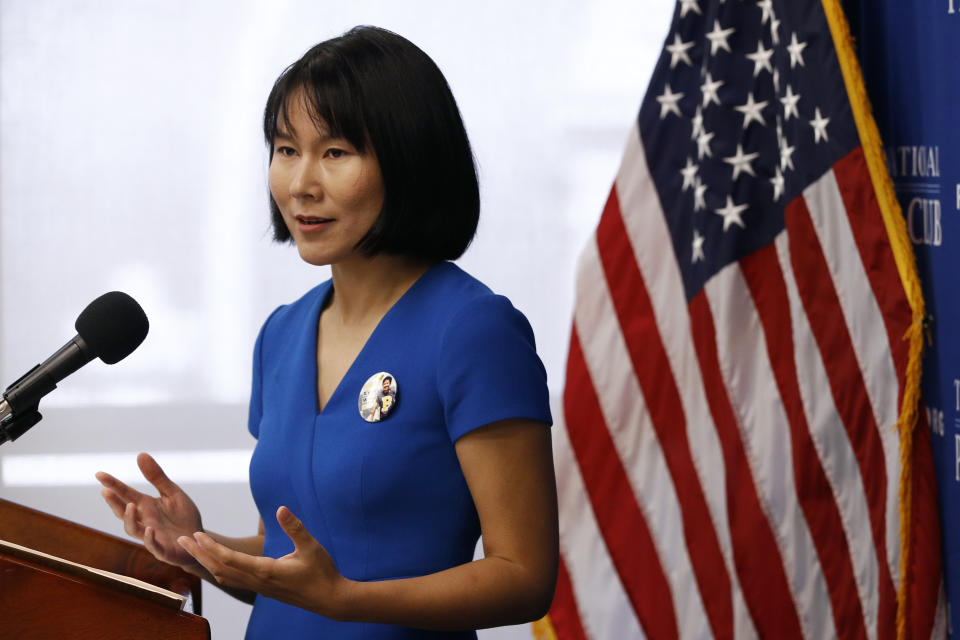 Hua Qu, the wife of Xiyue Wang, a Princeton University graduate student being held at an Iranian prison, speaks at a news conference to mark the third anniversary of her husband's imprisonment, Thursday, Aug. 8, 2019, at the National Press Club in Washington. (AP Photo/Patrick Semansky)