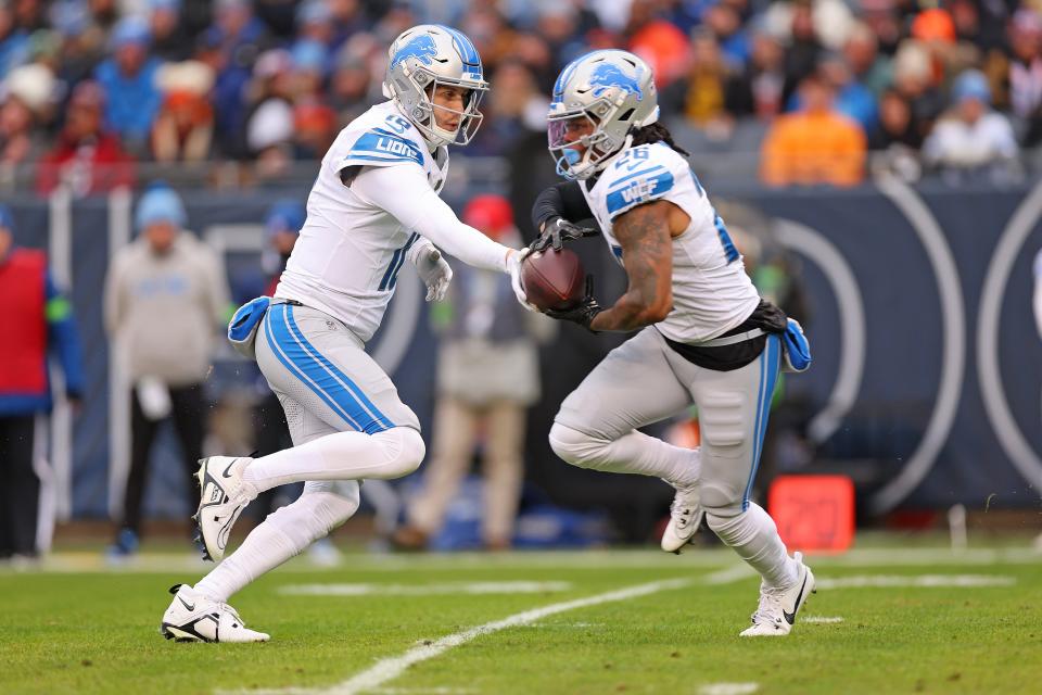 Lions quarterback Jared Goff hands the ball off to running back Jahmyr Gibbs during the first quarter on Sunday, Dec. 10, 2023, in Chicago.