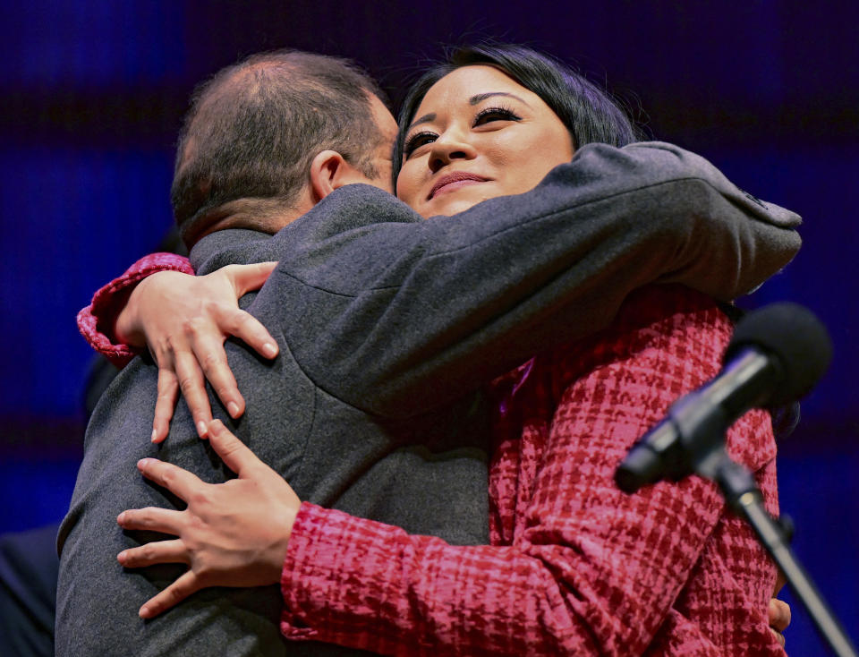 St. Paul City Council President Mitra Jalali gives her dad, Dr. Hossein Jalali, a hug after her oath of office during the inauguration ceremony for St. Paul City Council members in St. Paul, Minn. on Tuesday, Jan. 9, 2024. The youngest and most diverse city council in the history of Minnesota's capital city was sworn into office Tuesday, officially elevating the first all-female St. Paul City Council into public service at City Hall. (John Autey /Pioneer Press via AP)