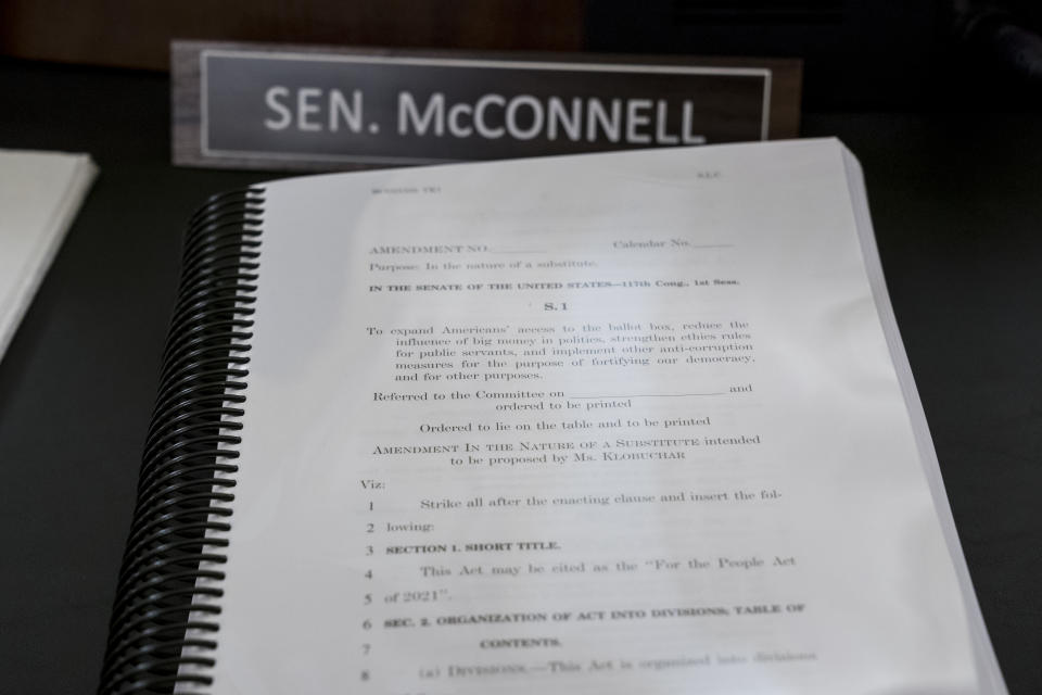 A book of amendments awaits Senate Minority Leader Mitch McConnell of Ky., at a Senate Rules Committee hearing at the Capitol in Washington, Tuesday, May 11, 2021. (AP Photo/J. Scott Applewhite)