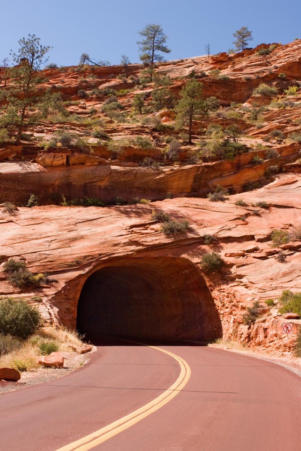 <p>Built in 1930, the Mount Carmel Highway cuts through a part of Arizona’s Zion National Park. When the route was completed, it shortened the distance from Zion, Arizona to Bryce, Utah, by 70 miles.</p>