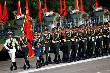 Troops prepare for the arrival of Chinese President Xi Jinping (unseen) at the People's Liberation Army (PLA) Hong Kong Garrison in one of events marking the 20th anniversary of the city's handover from British to Chinese rule, in Hong Kong, China June 30, 2017. REUTERS/Damir Sagolj