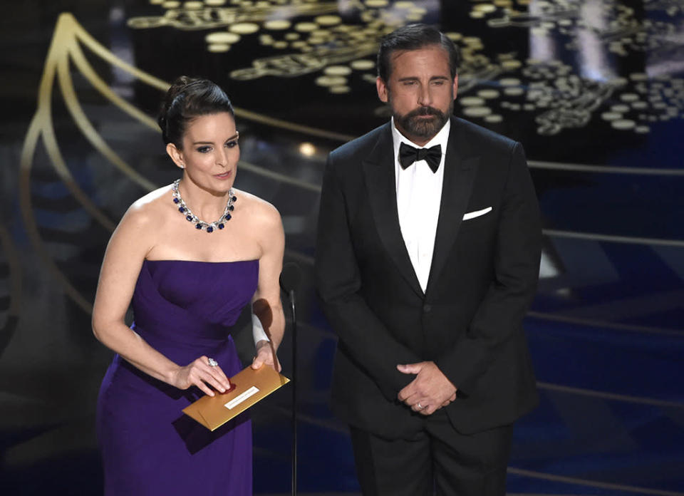 Tina Fey and Steve Carell present the award for best production design at the Oscars on Sunday, Feb. 28, 2016, at the Dolby Theatre in Los Angeles. 