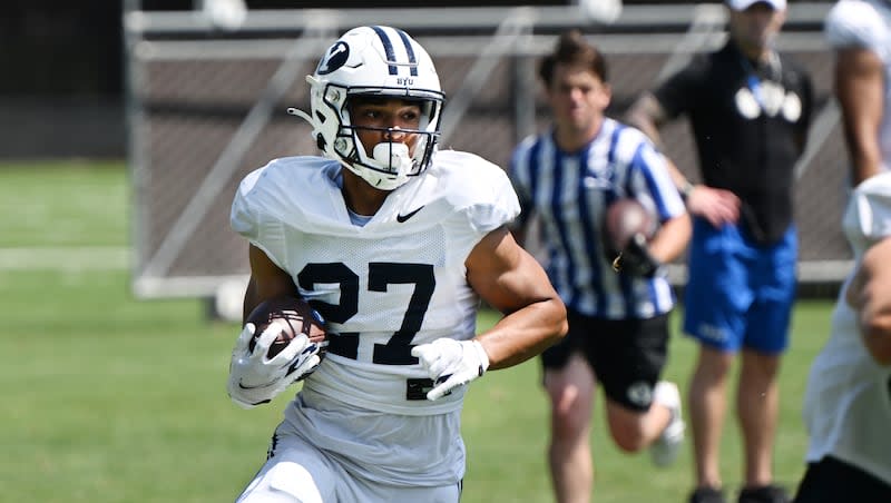 BYU running back LJ Martin looks for a pathway during practice in Provo on Tuesday, Aug. 8, 2023. The second-year back is eager to battle for RB1 duties this spring.