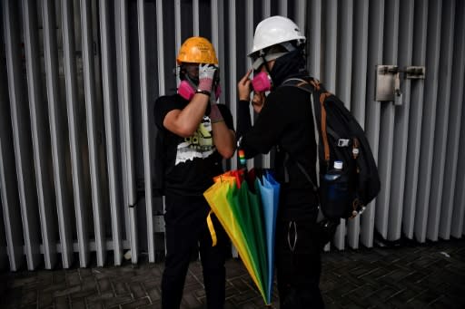 Hong Kong protesters who throw petrol bombs are known as 'wizards' while teams who extinguish tear gas canisters are dubbed 'firefighters'