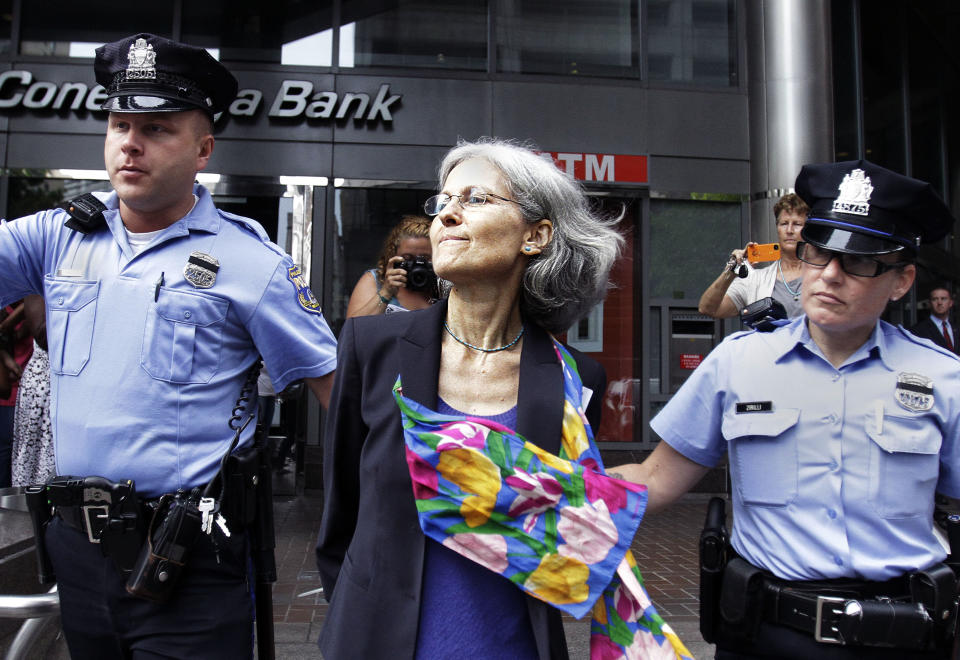 Green Party presidential nominee Jill Stein, is transported in restraints to be arrested after a sit-in at a downtown Philadelphia bank over housing foreclosures. Wednesday, Aug. 1, 2012, in Philadelphia. About 50 Green Party supporters hope to protest at Fannie Mae. (AP Photo/Brynn Anderson)
